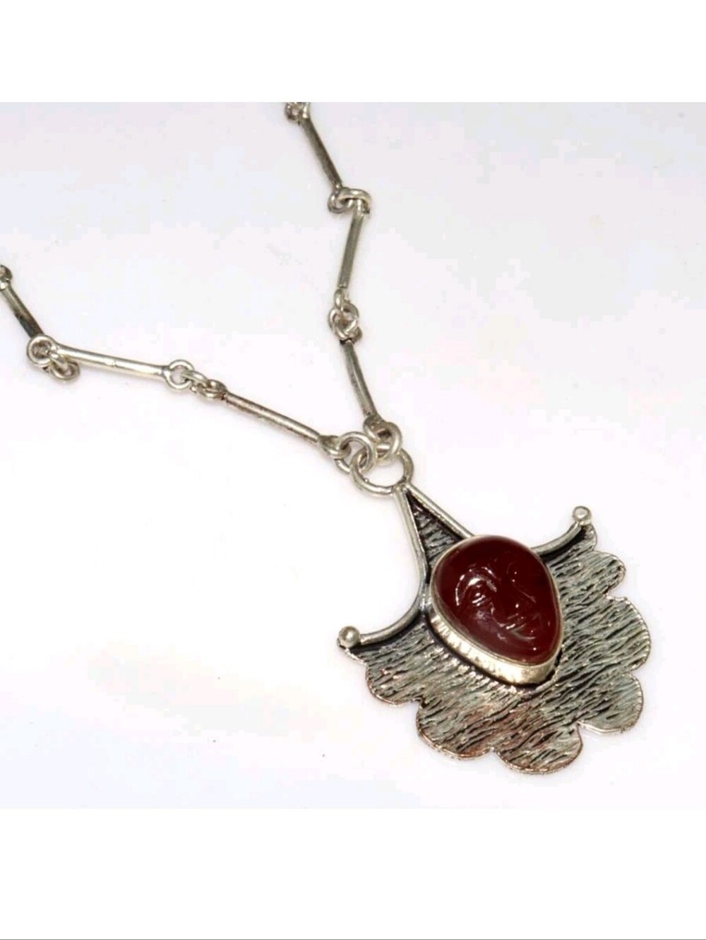 New Carved Orange Goddess Face Silver Necklace.